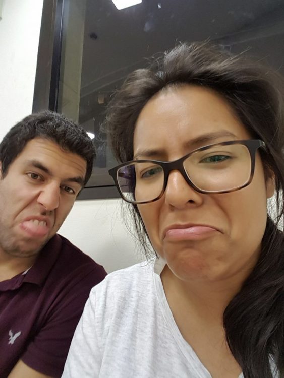 woman wearing glasses and frowning in a selfie with a guy