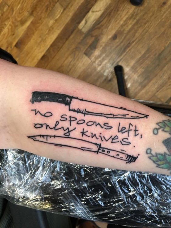 tattoo that says 'no spoons left, only knives' with two knives