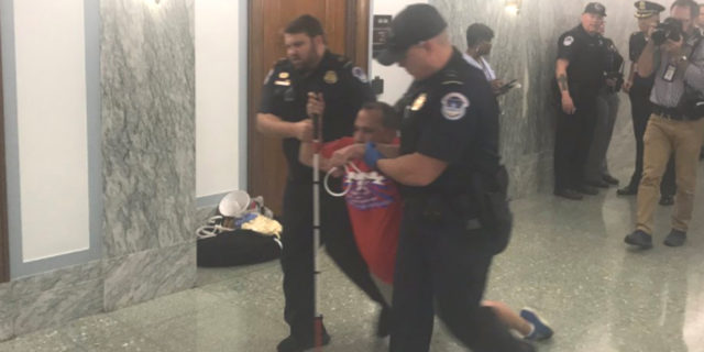 Protesters With Disabilities Forcibly Removed From Graham-Cassidy Bill Hearing Blind man being arrested and dragged by police