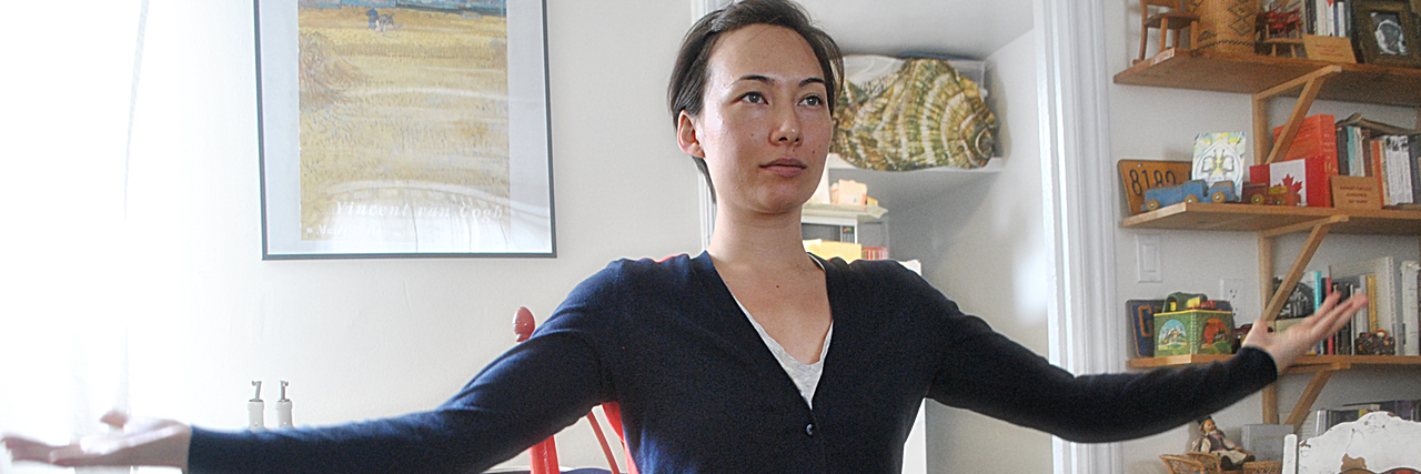 Exercising With Chronic Pain Photo of a woman sitting with her arms stretched out