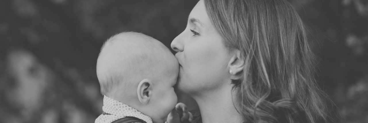Practical Tips for Helping Out a Mother of Kids With Disabilities Mother kissing baby's head