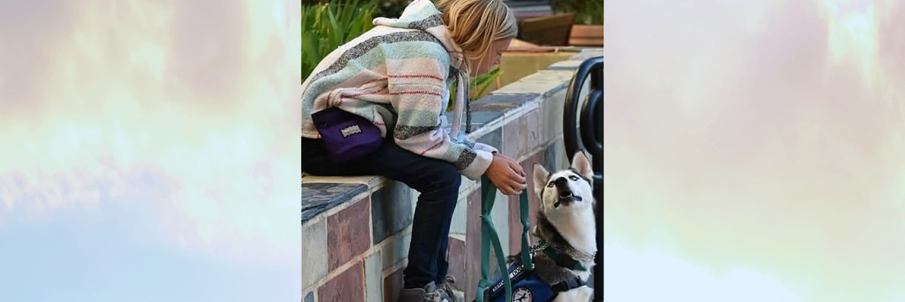 Missy's daughter with her service dog, Echo.