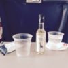 celebrating with a drink on the plane