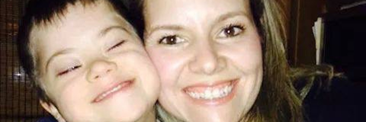 My Son With Down Syndrome Gave Me the Gift of Hope Mother hugging son with Down syndrome, both smiling