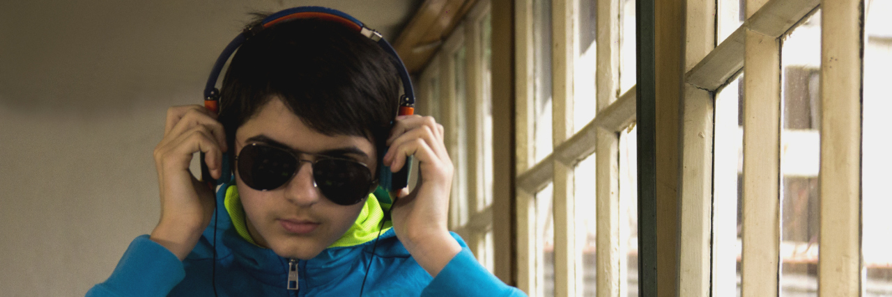 Young man wearing headphones.