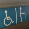 Disability sign showing a wheelchair user and cane user.