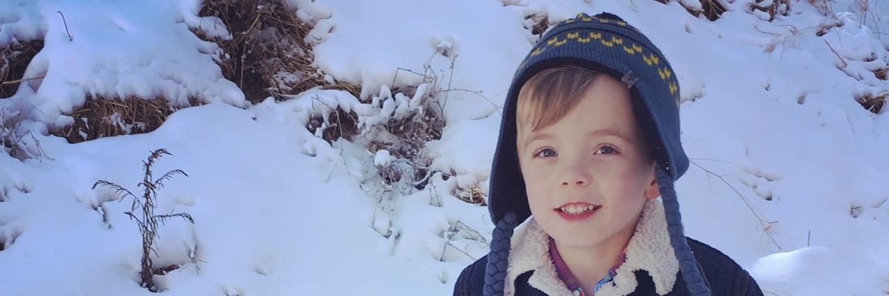 What Helped My Mental Health While Caring for My Child With CHD Little boy playing in snow