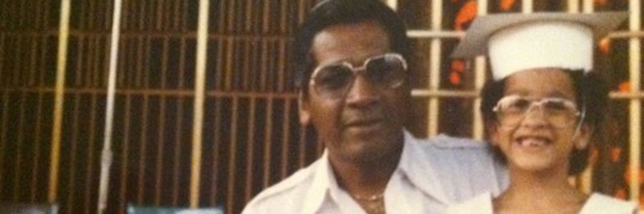 Grief and Loss: Reconnecting With Memories of My Dad The author sitting with her father