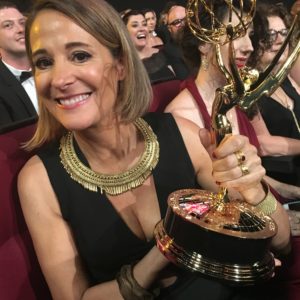 Casting Director Sasha Alpert holding her Emmy