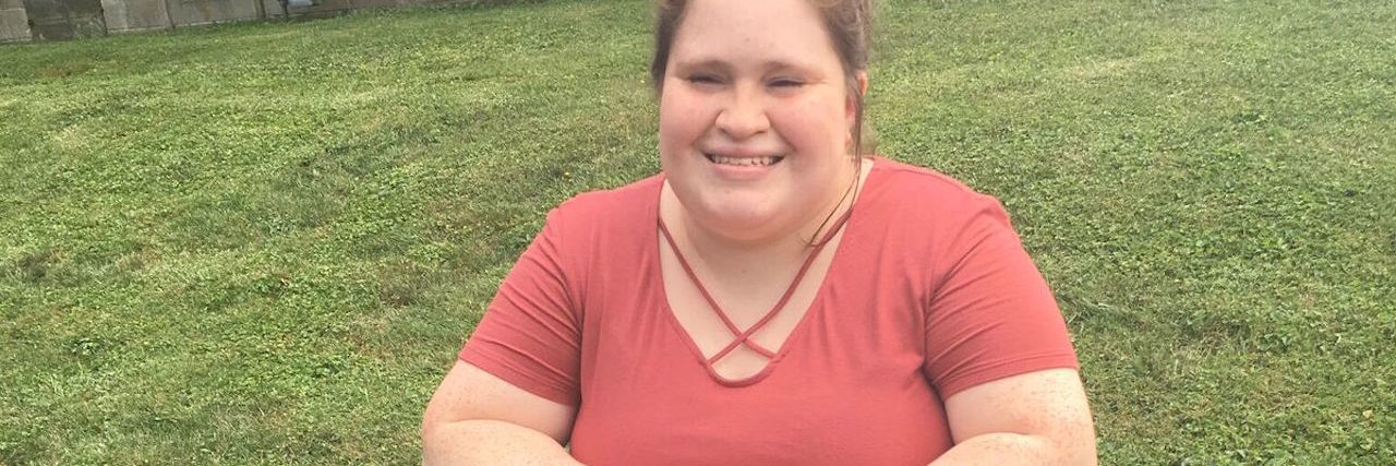 Using a Walker or Mobility Aid When You're Young woman sitting on her four-wheel walker