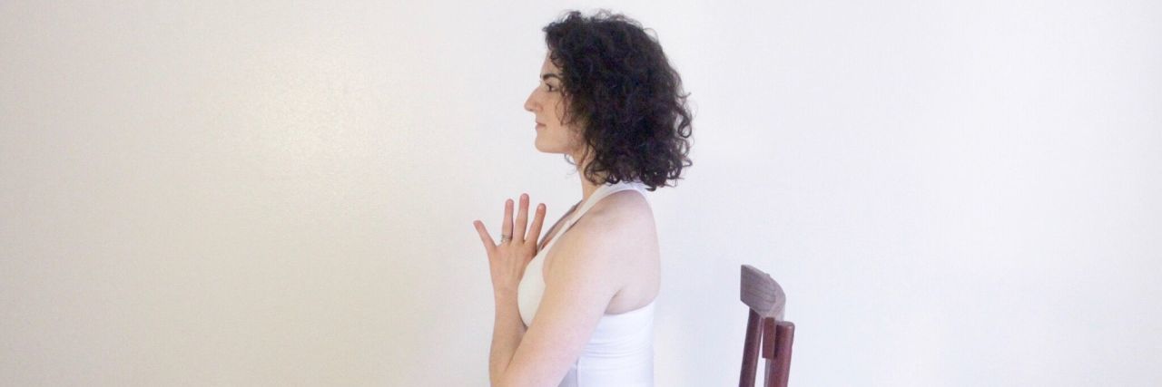 Empowering Chair Yoga Poses for Chronic Illness Warriors woman doing chair yoga pose