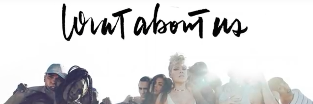 Why P!NK’s Song 'What About Us' Is My Anxiety Battle Cry Image with singer P!nk and other people huddled together