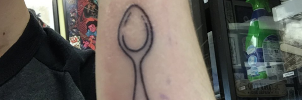 6 Ways to Save Your Spoons in College The writer showing her new spoon tattoo on her arm.