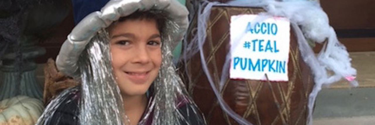 Thank-You Letter to Parents Who Put Out Teal Pumpkins at Halloween The author's son dressed as Albus Dumbledore, holding a teal pumpkin