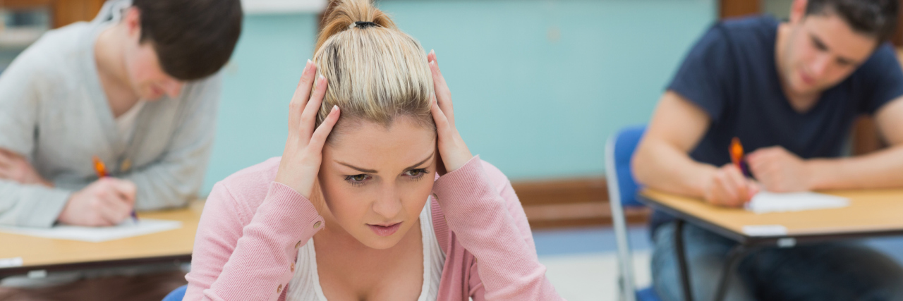 anxious student in classroom during exam