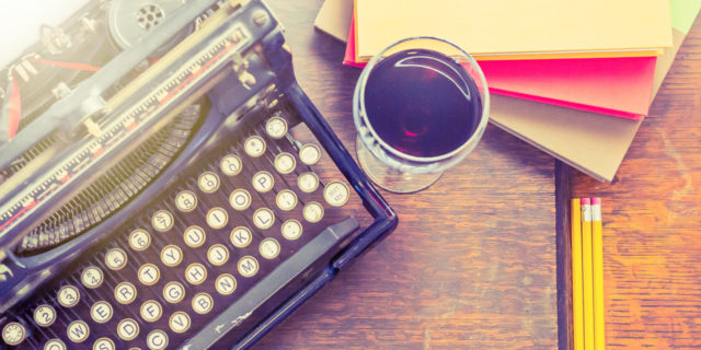 The Advice I'd Give Myself During My POTS Diagnosis A vintage typewriter with paper, pencils, and a glass of wine next to it.