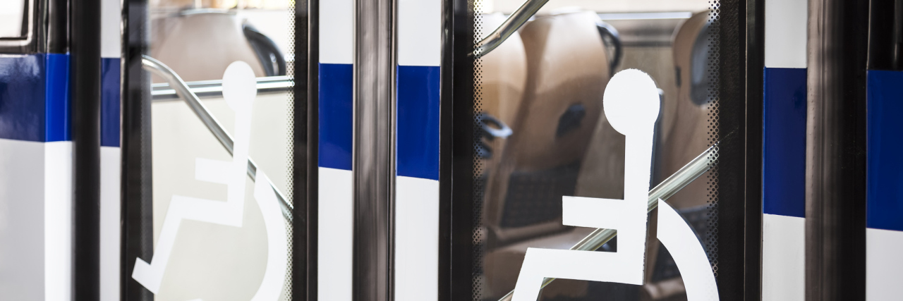 When Able-Bodied People Sit in the Disability Seats on the Bus disability signs on the door of a bus