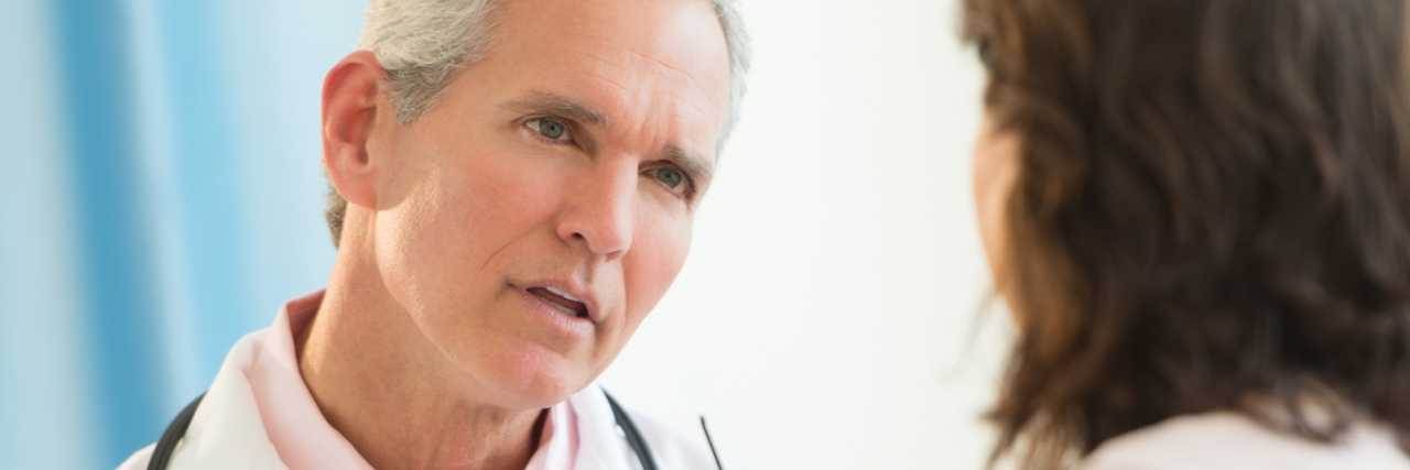 Asthma: Questioning Yourself When ER Doctors Doubt Your Illness male doctor talking to female patient