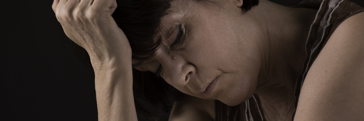 Asthma: Asking Yourself Questions, Dealing With Uncertainty of Illness woman leaning her head against her hand and looking upset