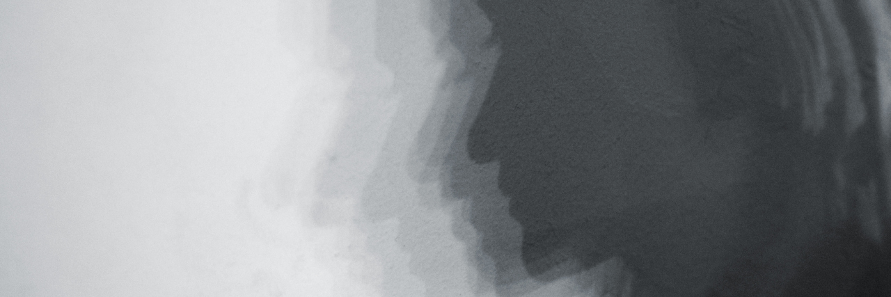 Why Anxiety Feels Like a Shadow Following Me Around shadow of woman face, white grunge wall background