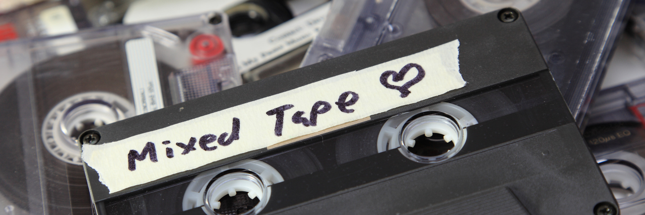 A mix tape on top of several other tapes.