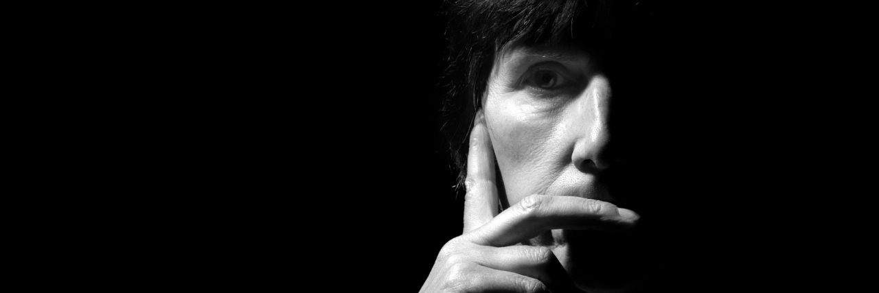 I'm Not Too Busy to See You, I Just Can't Fake That I'm Not In Pain A monochrome image of a middle-aged woman.