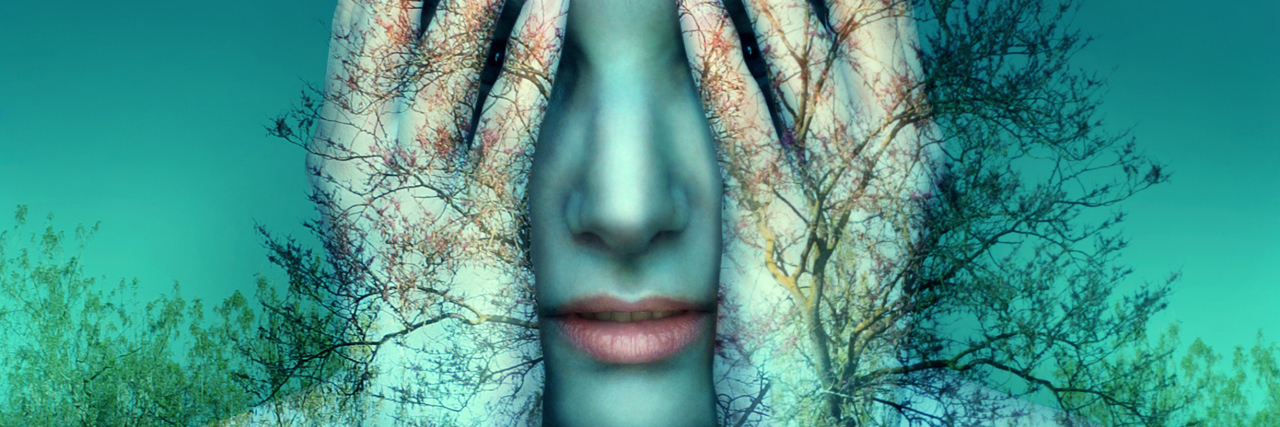 Myalgic Encephalomyelitis Is More Than Just Chronic Fatigue woman covering her eyes with a double exposure of blue trees