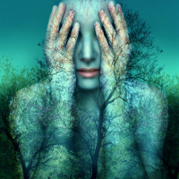 woman covering her eyes with a double exposure of blue trees