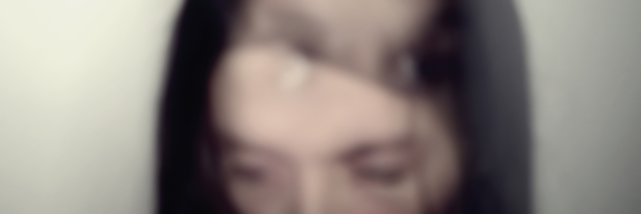 Having Multiple Selves With Bipolar Disorder Out of focus, multiple exposure portrait of a young Caucasian woman.