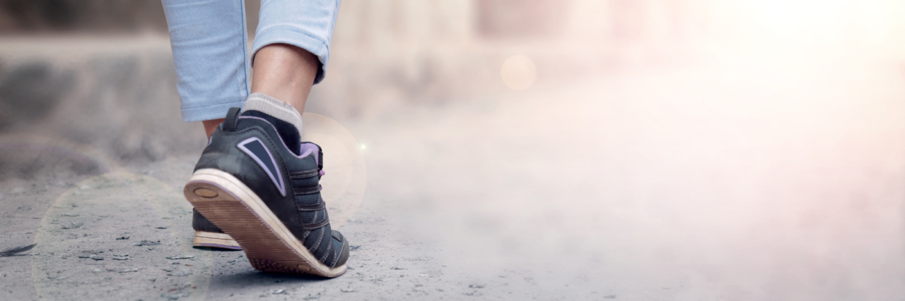 Not Apologizing for Walking Slowly With Complex Regional Pain Syndrome woman walking outside