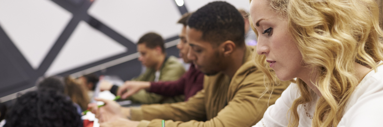 POTS: Introducing Yourself as Having a Disability at School students taking notes during college lecture