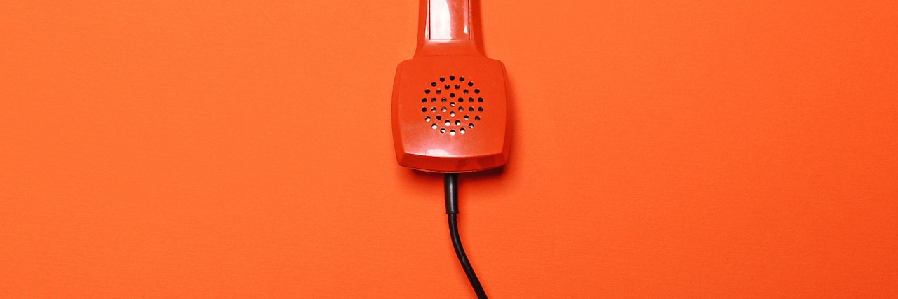 What Happened When I Called a Suicide Hotline orange phone