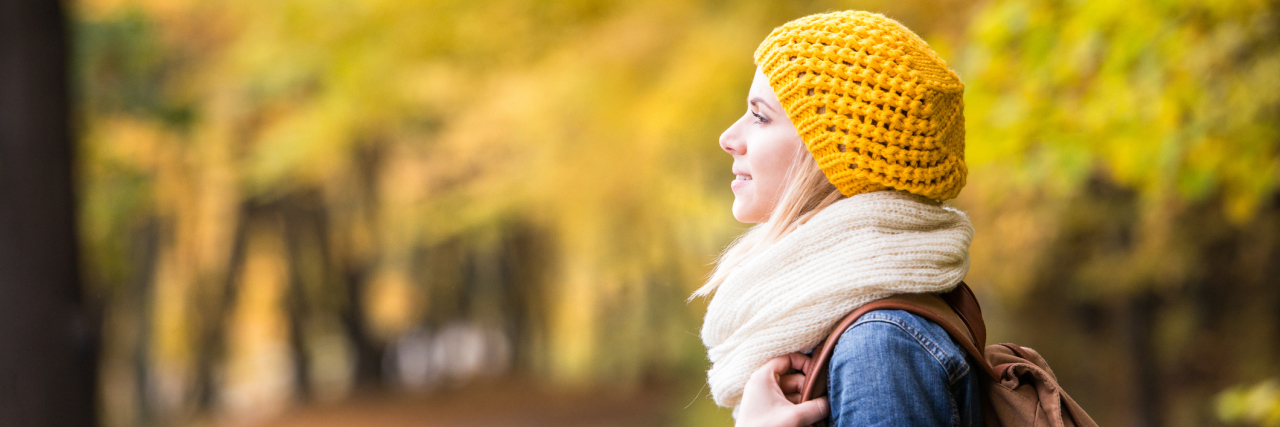 Fibromyalgia, Depression: What to Remember During September woman walking in the park during autumn
