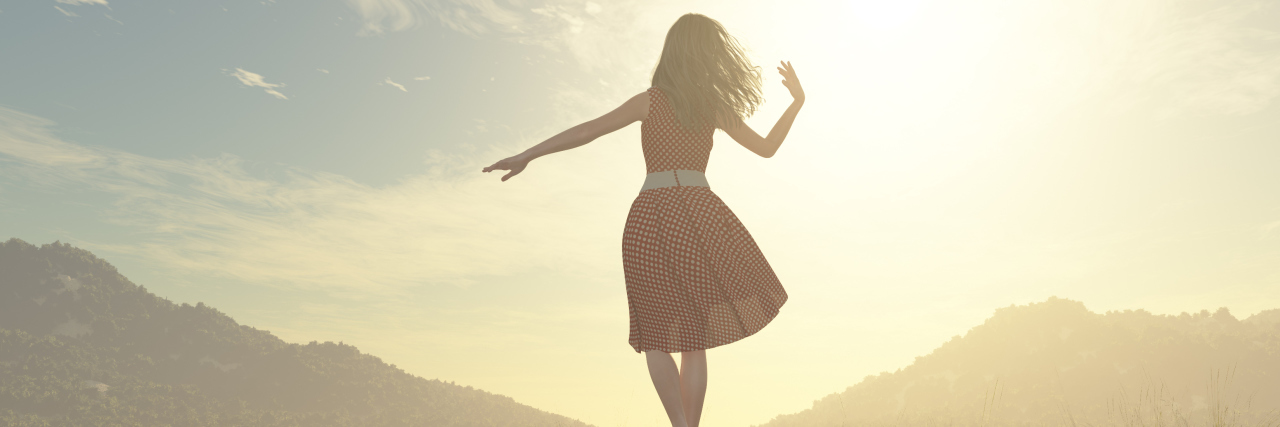 CRPS: Finding Balance Between Mental and Physical Capabilities woman walking down a railroad and balancing on the rail