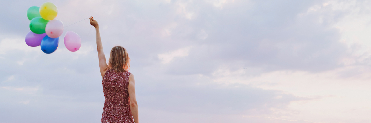 7 Reminders for Those New to Eating Disorder Recovery woman holding a balloon