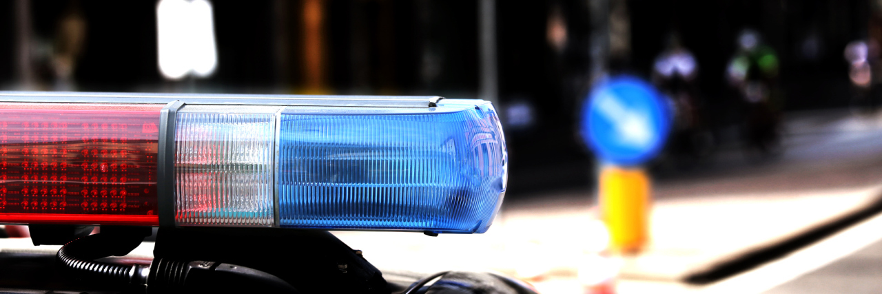 Educating Police About Autism: We Must Do More Red and blue flashing lights of police car.