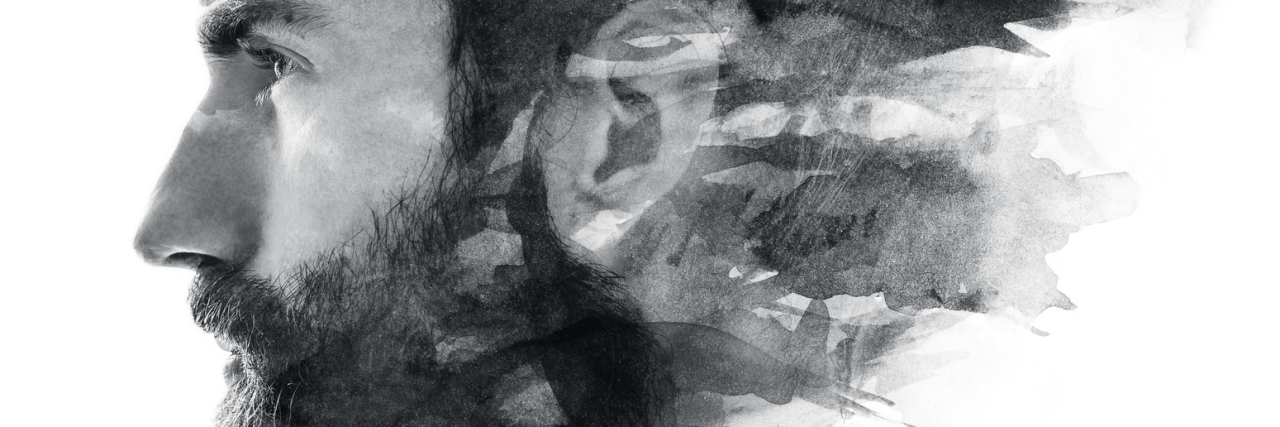 Why I Hide My Happiness as Someone With Depression Portrait of a bearded man fading in black and white