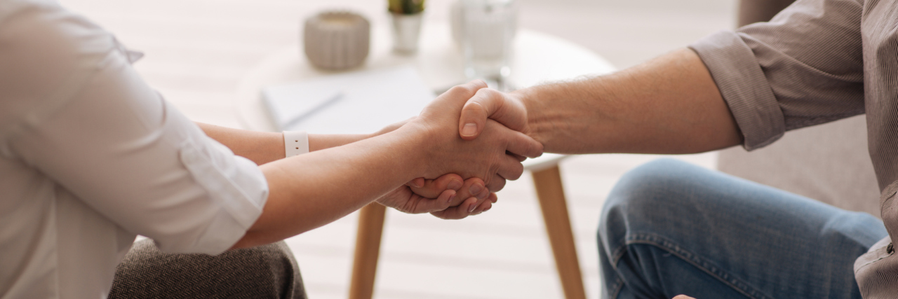How Silencing Your Voice Can Impact Your Mental Health Greeting each other. Close up of a handshake of two people while greeting each other