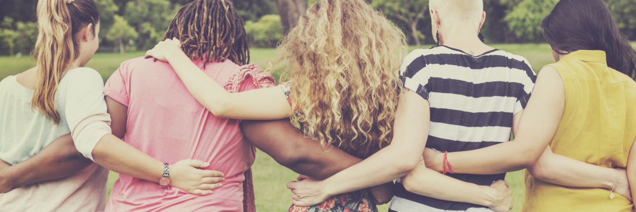 8 Ways to Get Involved in Pain Awareness Month row of friends with their arms around each other, view from the back