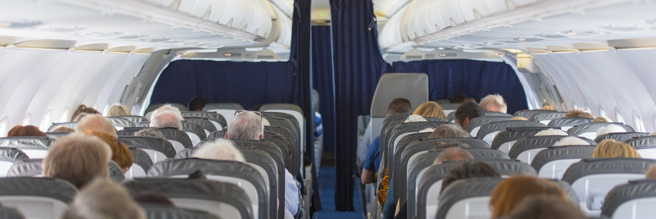 Air Travel Accessibility for People With Food Allergies, Disabilities Commercial aircraft cabin with passengers.