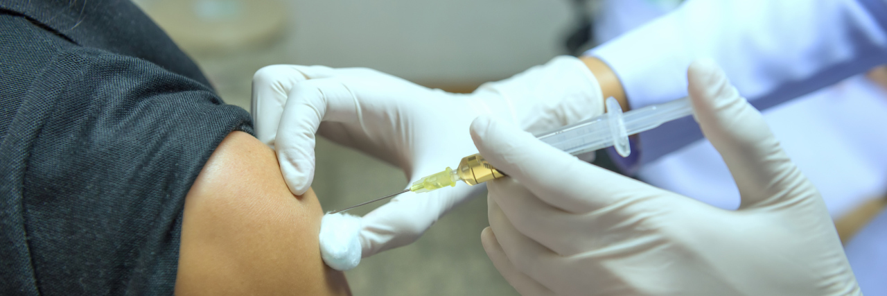 Shwachman Diamond Syndrome: Being Judged for Getting the Flu Shot woman getting a flu shot