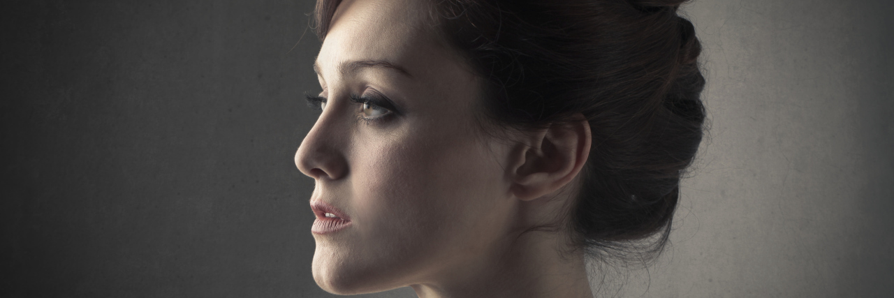 Why I'm Jealous of Healthy People A woman looking off to the distance with a sad expression on her face.