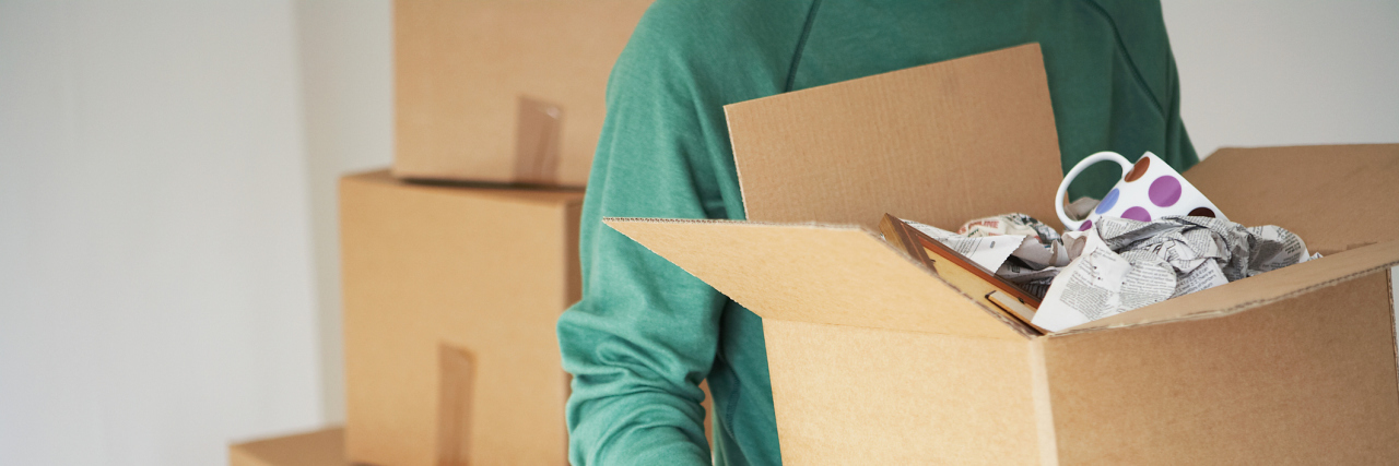 5 Tips for Living Alone When You Have a Mental Illness Man Carrying Cardboard Box