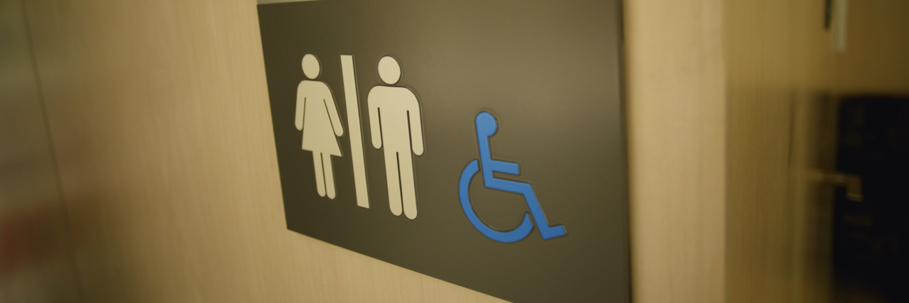 Disability sign on a restroom door.