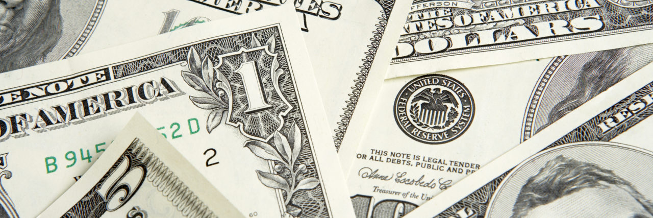 5 Ways Having Bipolar Disorder Affects My Finances Dollar bills