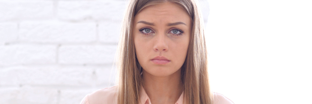 When Your Chronic Pain Leaves You Feeling Exhausted A photo of a woman with a tired and sad expression.