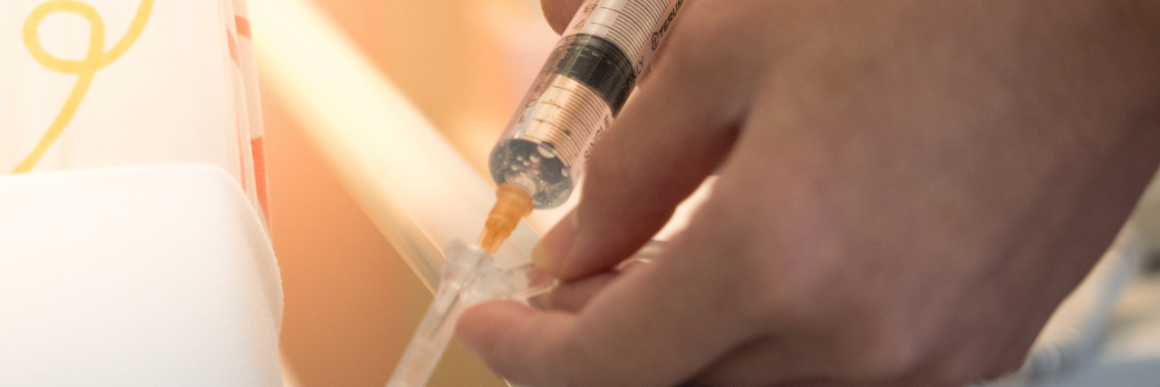 Asking Nurses to Use Port-a-Cath for Blood Draws and Infusions woman administering IV