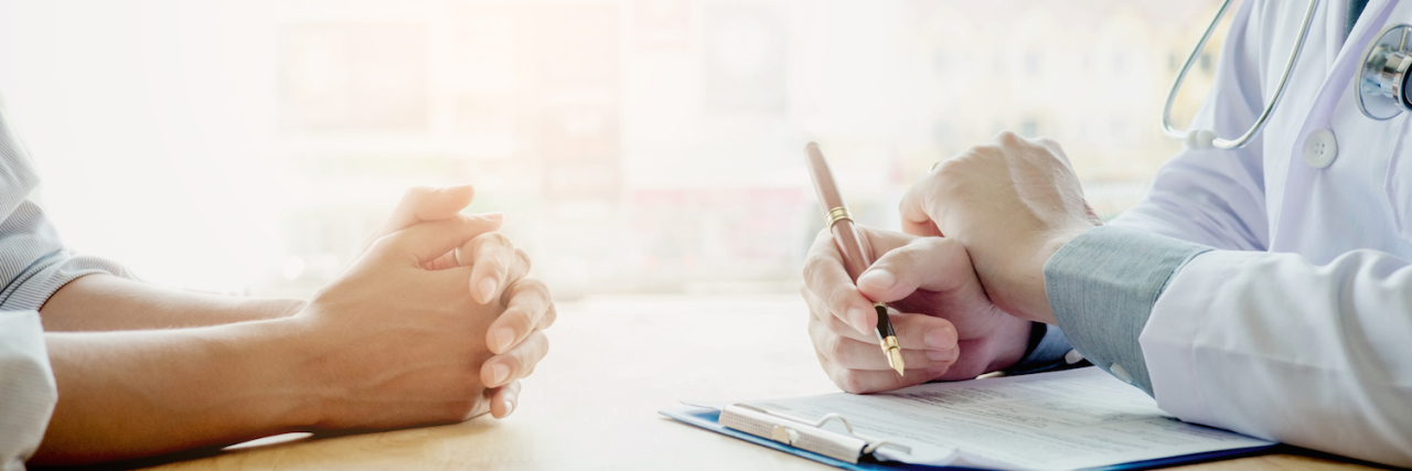 Letter to Doctor Who Doesn't Feel Like You're Doing Enough to Help Me Doctor and patient sit at table and talk