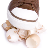 Shoe walking on eggshells.