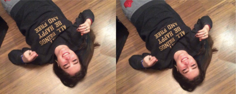 woman lying on the floor laughing
